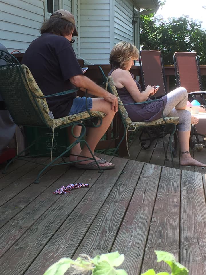 man and woman in deck chairs